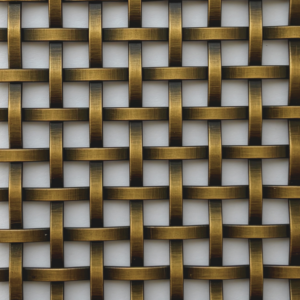Close-up of a gold-toned woven lattice pattern formed by interlaced metal strips.